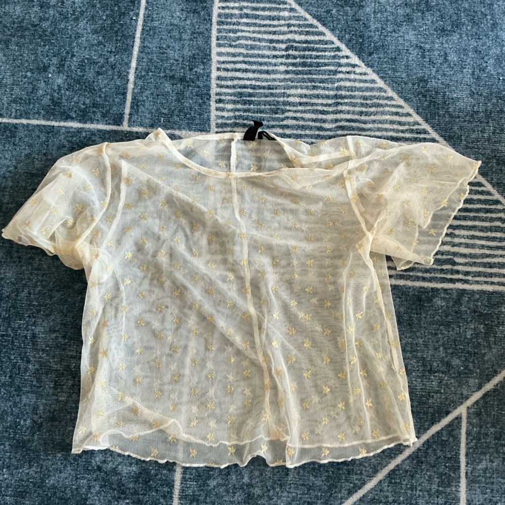 Urban Outfitters out from under sheer star Top